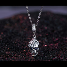 Skull in Hand Pendant