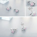 Heart-shaped earrings with pink zirconia